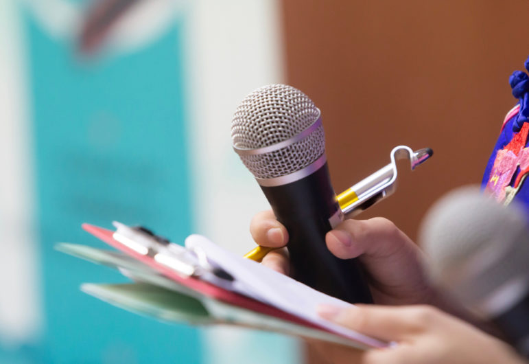 Press holding binder, arm, microphone, reporting tactic