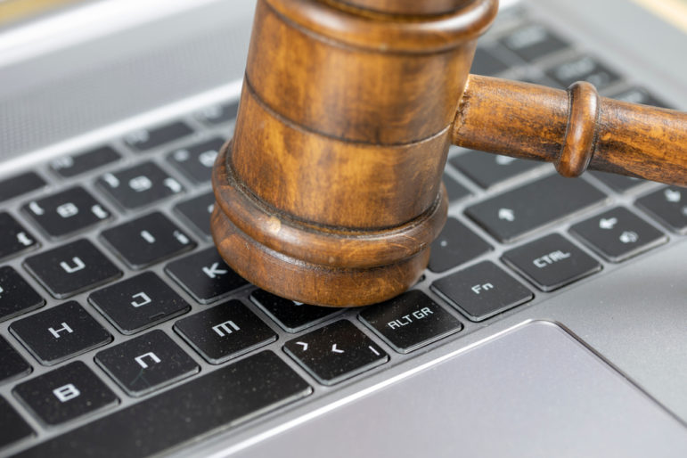 Gavel on computer keyboard