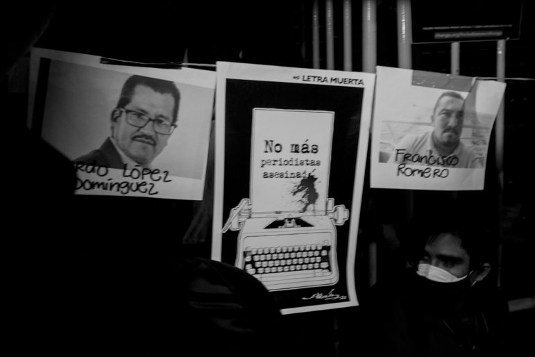 Protest signs for killing of two Mexican journalists in 2022