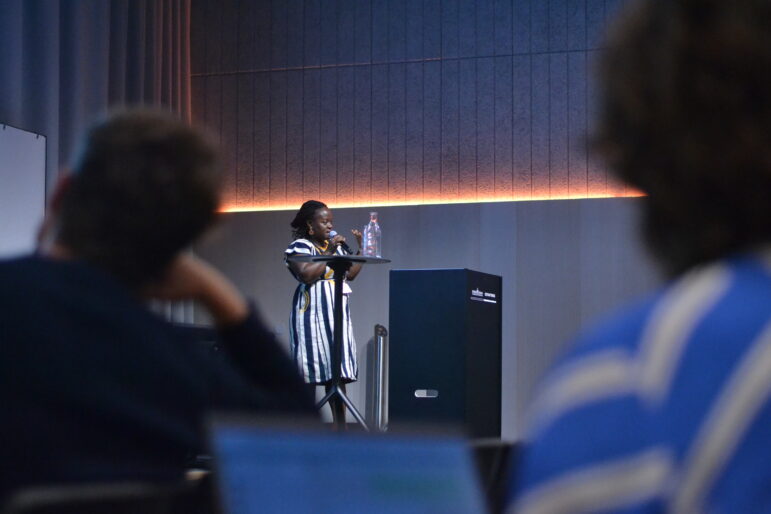 Madeleine Ngeunga discusses covering environmental crimes during a panel at GIJC23.