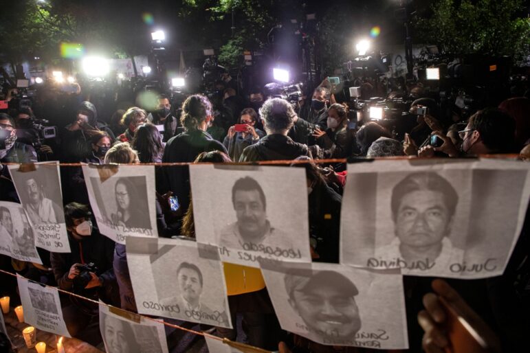 Journalists holding a demonstration in front of the Secretariat of the Interior in Mexico City to protest the killing of media workers, some of whom are memorialized on the signs. Image: Shutterstock, Julio Ortega