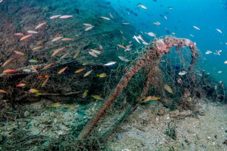 Abandoned ghost nets in coral reef