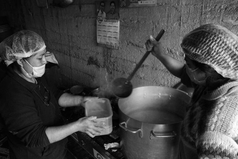 Women prepare food in a soup kitchen for the elderly in Lima, Peru. Image: Shutterstock