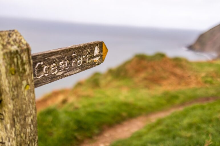 Sign for the South West Coast path in Exmoor, England.