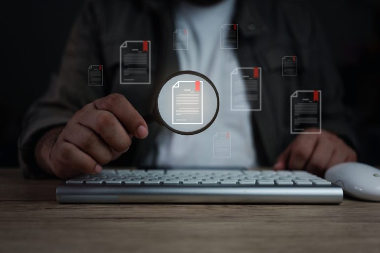 Online files, investigation, magnifying glass