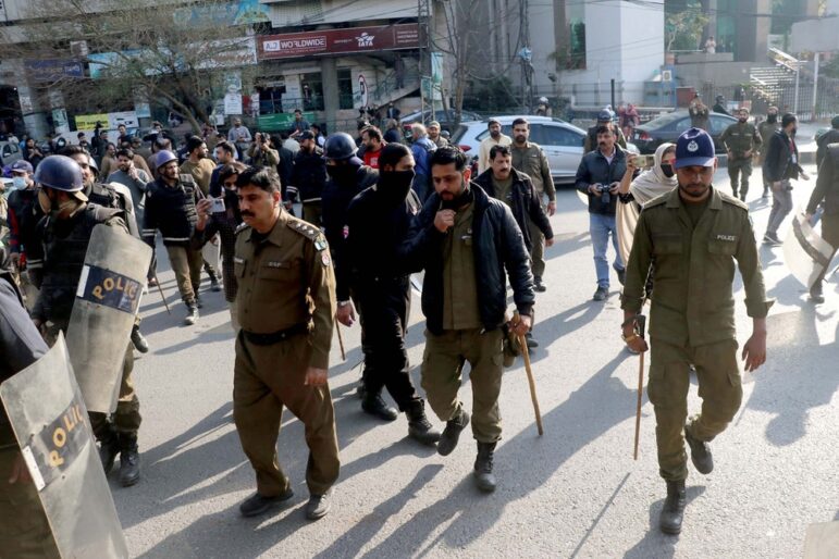 Police in Pakistan at protest in Lahore.