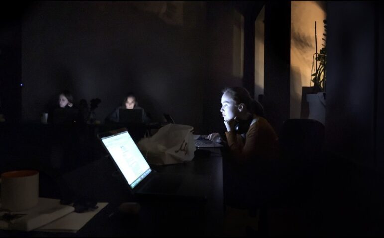 A woman reporter working in a blackout