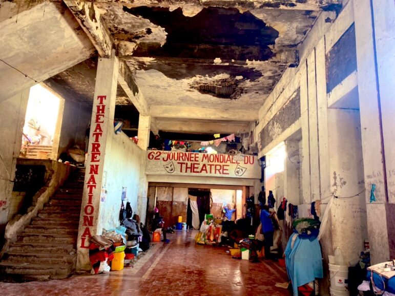 A theater destroyed in the 2010 earthquake currently serves as a shelter for people displaced by the ongoing violence or fleeing areas under the control of armed groups. Photo by Juan José Martínez D'Aubuisson and published with permission