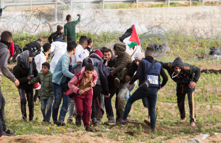 Israeli forces intervene in Palestinians during a the demonstrations near Gaza-Israel border in Rafah, in the southern Gaza Strip. Photo by Abed Rahim Khatib
