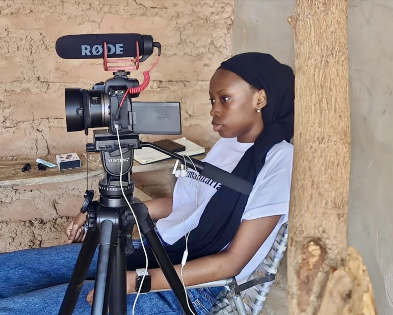 Zubaida records an interview with Nigerians who fled insecurity in northwestern Nigeria and relocated to Maradi, Niger Republic, where UNHCR supports economic empowerment initiatives for refugees and host communities.jpg