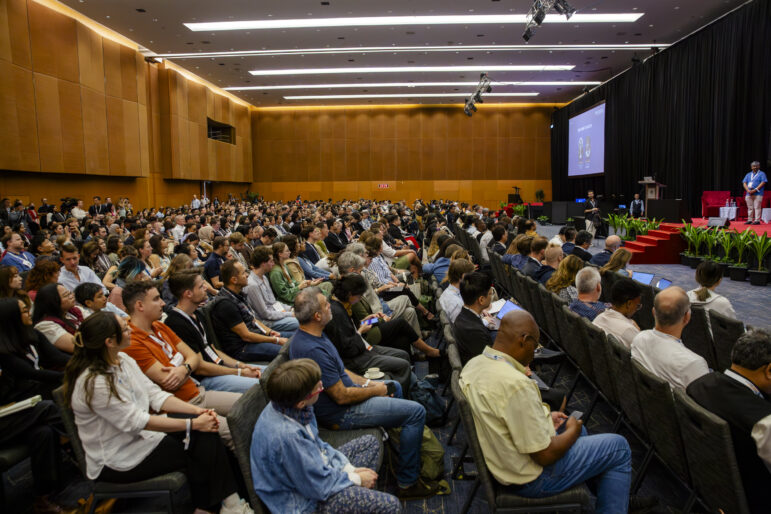 The crowd listening to the keynote address at GIJC25.